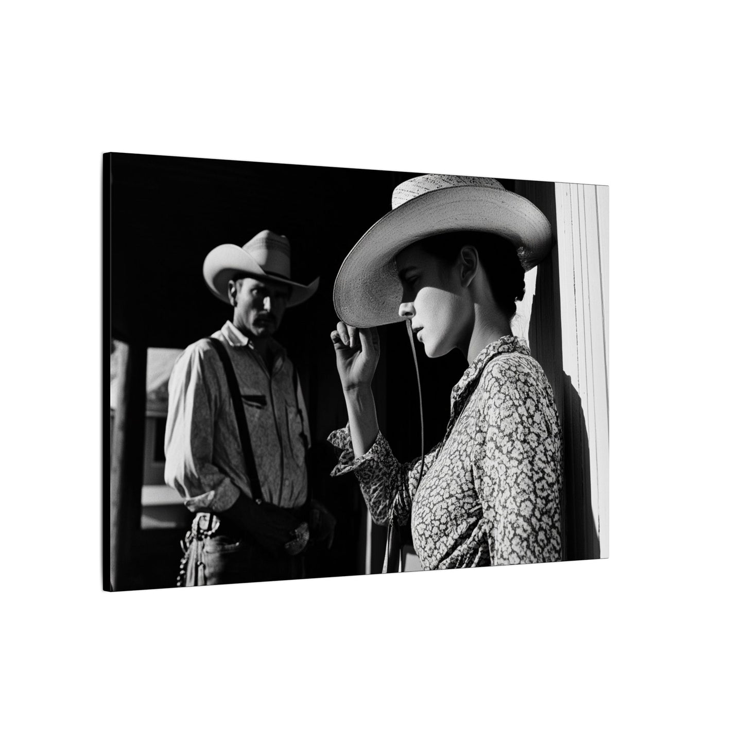 Side view. Black and white canvas print of a cowgirl tipping her hat as a cowboy looks on from the shadows, evoking mystery and classic Western emotion.