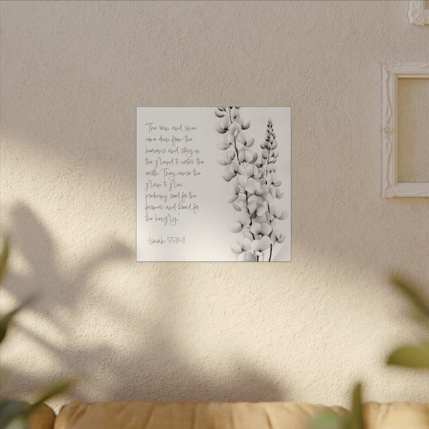 Alternate room view. Canvas print with Isaiah 55:10–11 scripture in handwritten text beside a delicate black-and-white botanical flower sketch.
