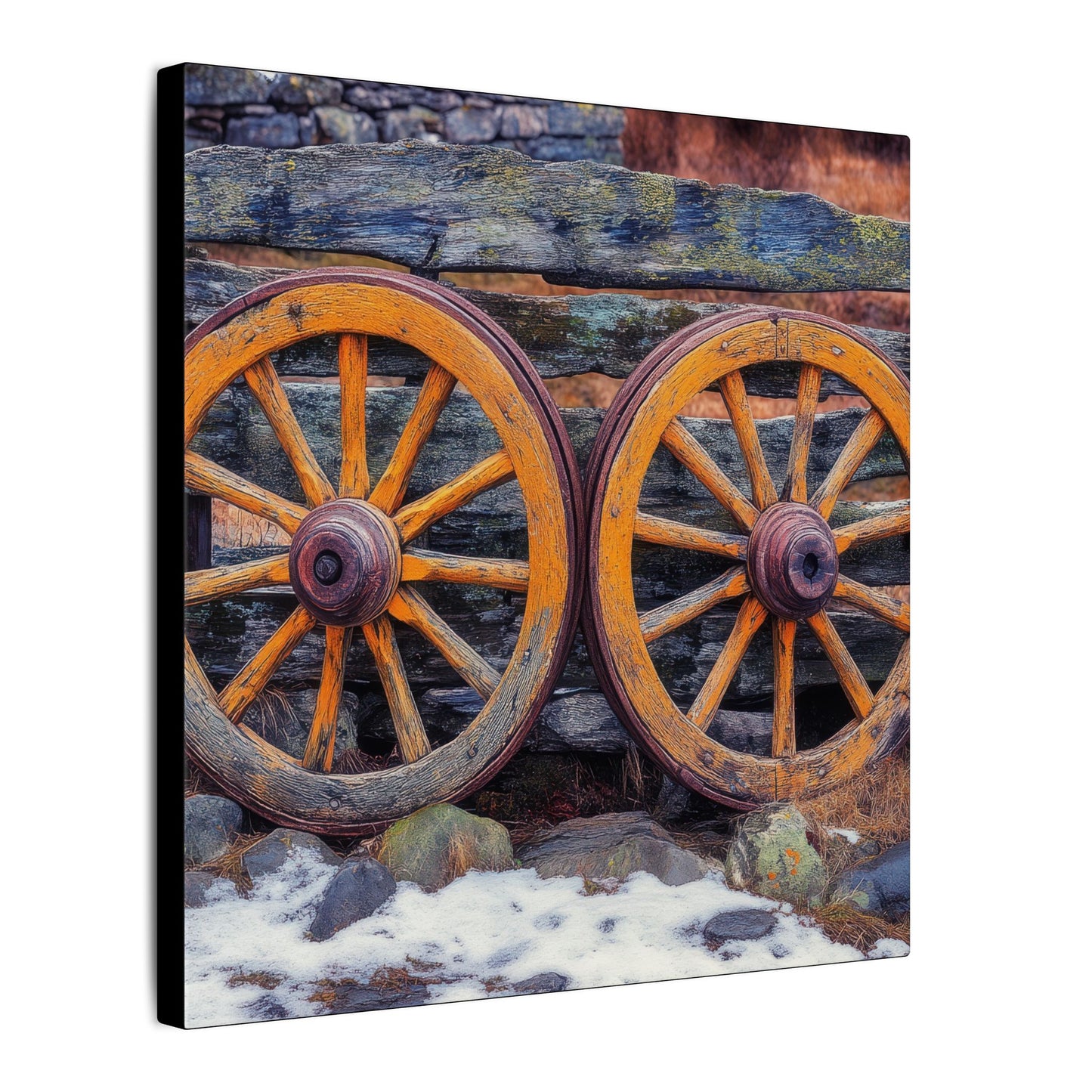 Side view. Canvas print featuring two antique wooden wagon wheels leaning against a rustic fence, with snow and stone in the foreground and rich textures throughout.
