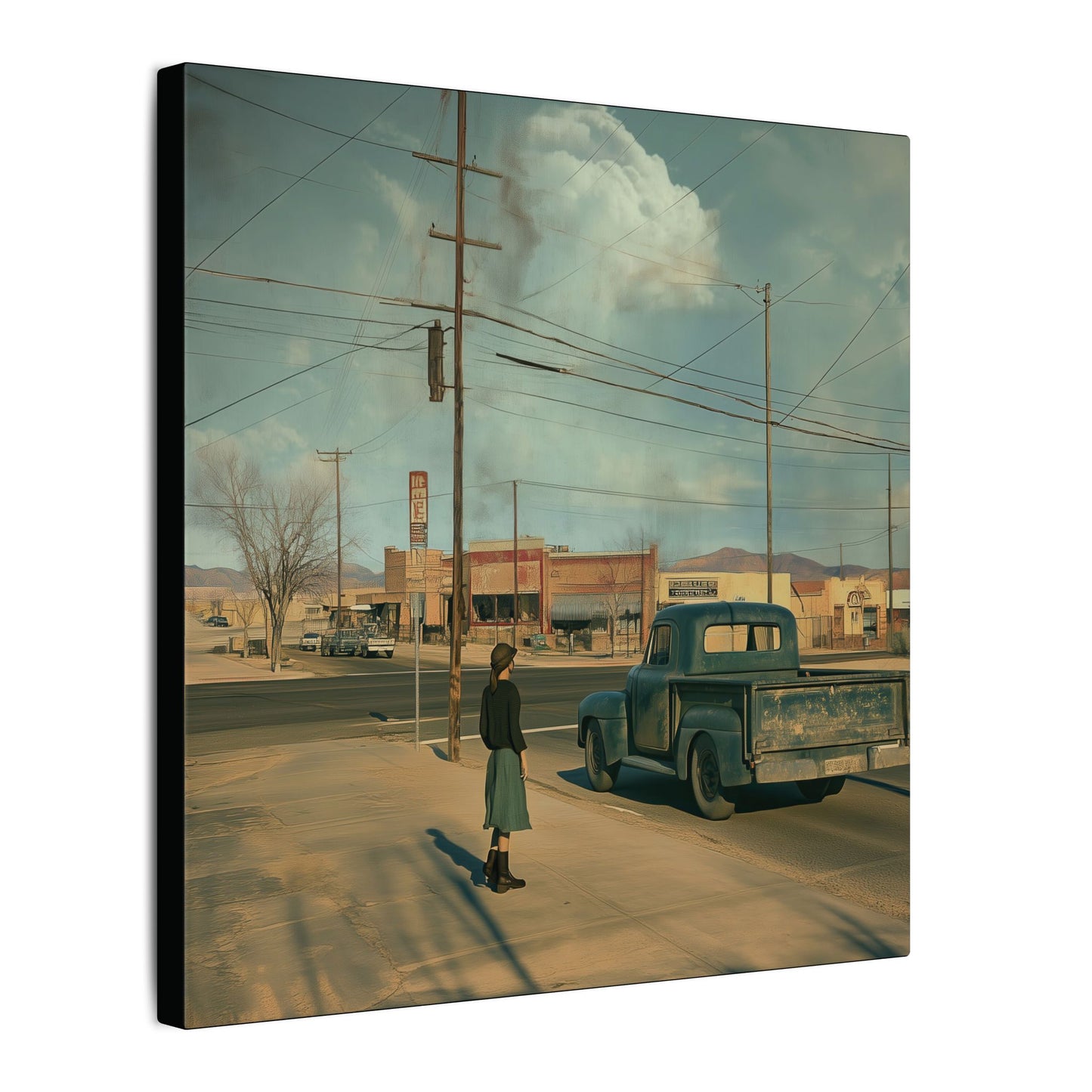 Side view. Canvas print of a woman standing on a sidewalk beside a vintage green pickup truck in a quiet Western town, with wide skies and distant mountains.