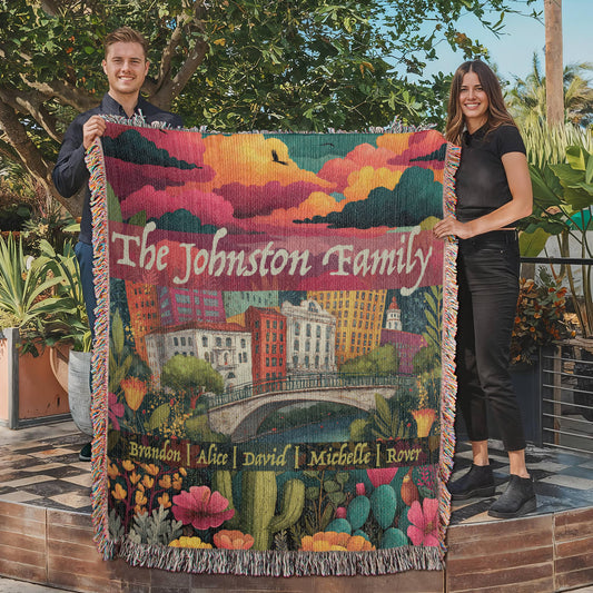Large size. Colorful heirloom woven blanket with the San Antonio skyline, River Walk, blooming Texas wildflowers, and customizable family names.