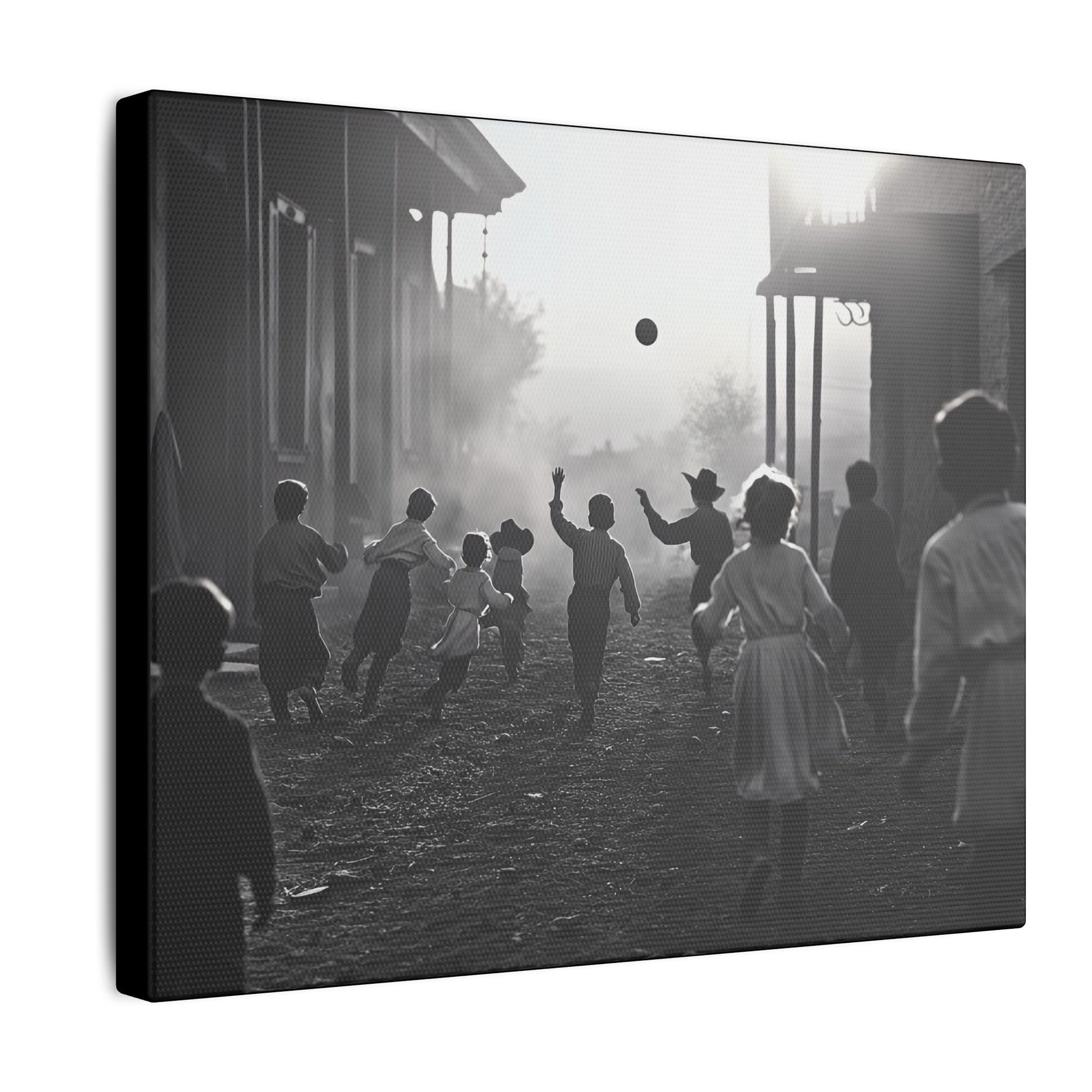 Black-and-white western street scene canvas print of children running and playing with a ball at sunset, capturing joyful movement and nostalgic charm, side view