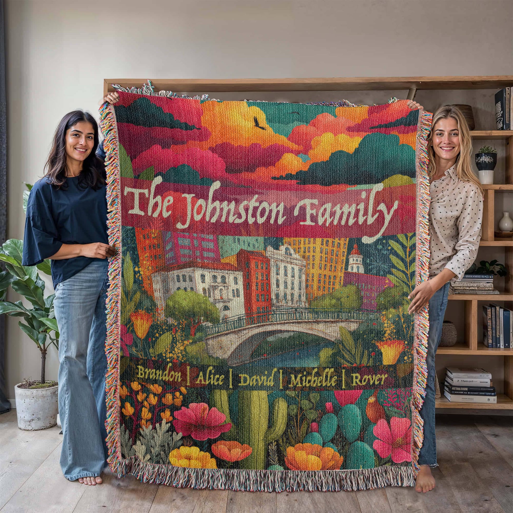 Large size in use. Colorful heirloom woven blanket with the San Antonio skyline, River Walk, blooming Texas wildflowers, and customizable family names.